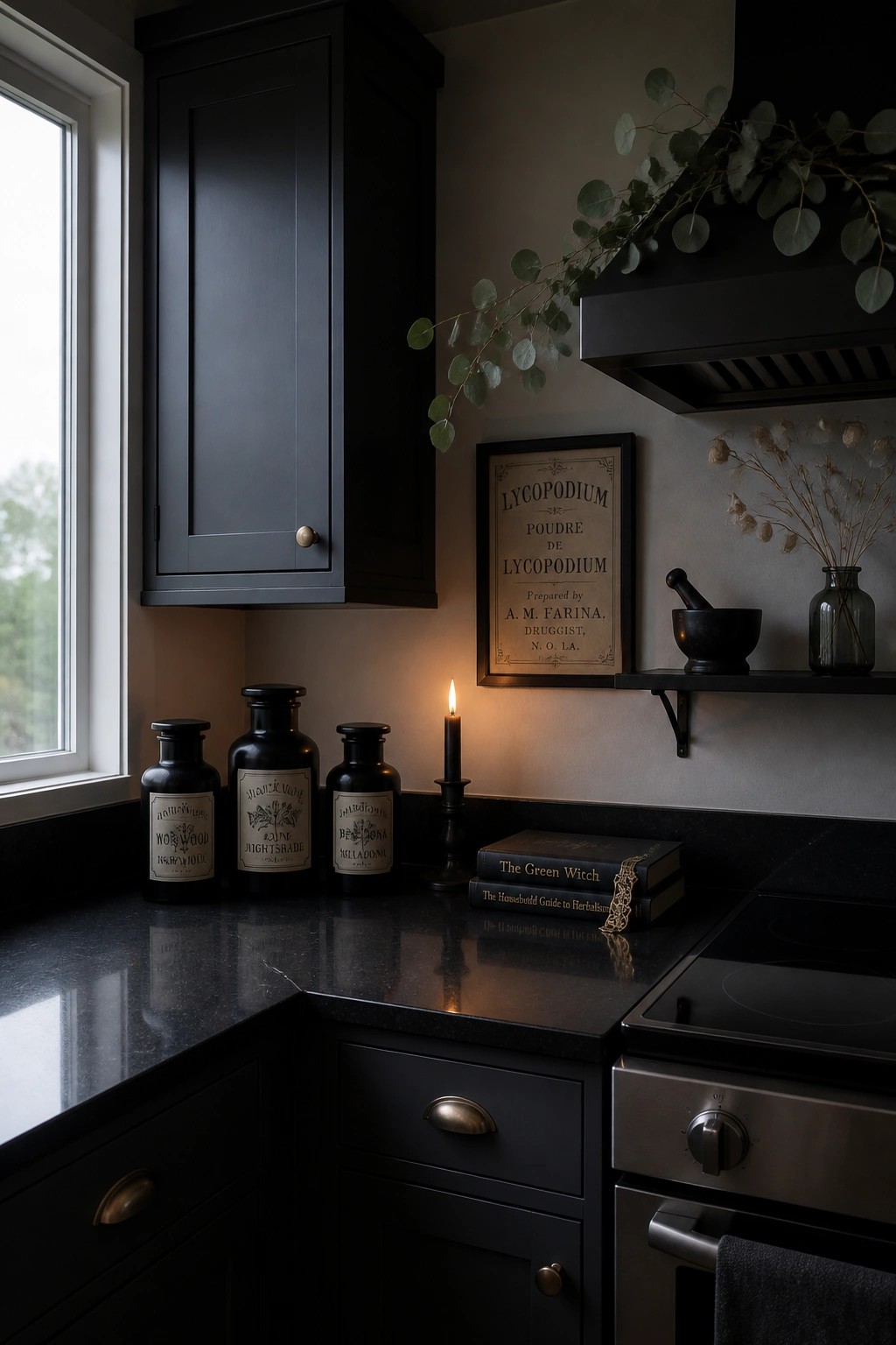 Dark kitchen corner showing three black apothecary bottles with old labels on a black countertop next to a lit candle and stacked books.